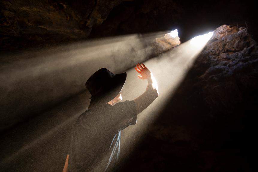 Mojave National Preserve, California: Light rays pass from the surface into the subterannean Cima lava tube.
