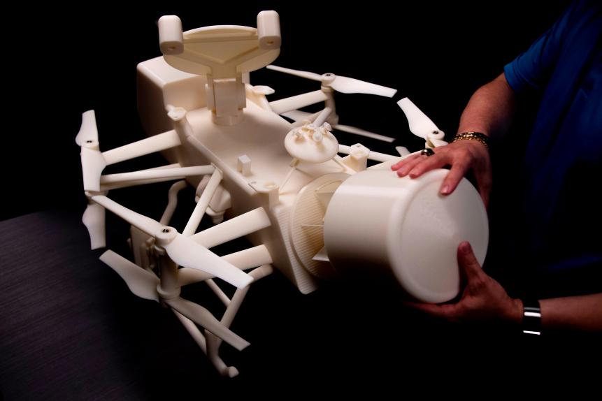 Ken Hibbard, Mission Systems Engineer for the Dragonfly mission, shows the one quarter scale 3D-printed model of the quadcopter drone named Dragonfly that will land on Titan in 2034 during an interview at Johns Hopkins Applied Physics Lab in Laurel, Maryland, on July 2, 2019. - Elizabeth Tuttle was overjoyed when, on June 26, she received a call from NASA: her project to send a drone copter to Titan, Saturn's largest moon, was given the green light and a budget of nearly a billion dollars. (Photo by Jim WATSON / AFP)        (Photo credit should read JIM WATSON/AFP via Getty Images)