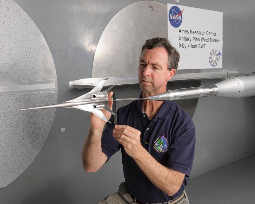 Don Durston, an aerospace engineer with a model supersonic aircraft, ready for testing in the 9- by 7-foot Unitary Plan Wind Tunnel at NASA’s Ames Research Center in California's Silicon Valley.