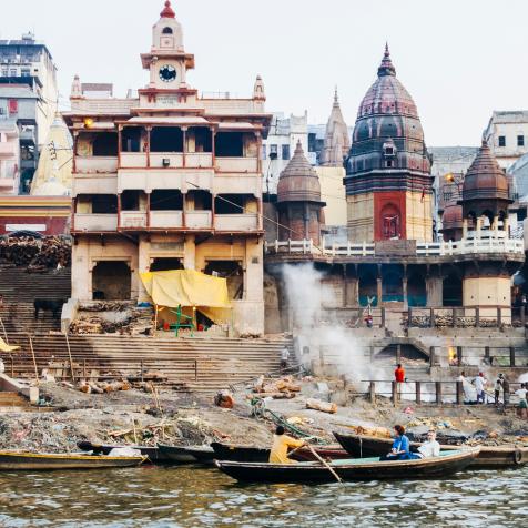 Varanasi, Uttar Pradesh, India : Manikarnika Ghat of cremations by the Ganges river and Baba Mashan Nath temple. According to Hinduism a dead human's soul finds salvation (moksha), when cremated here.