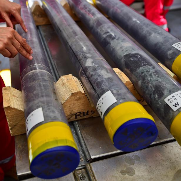 Scientists work with samples of rock in a laboratory in the L/B MYRTLE Offshore Support Vessel, -a scientific plataform working in the Gulf of Mexico- in front of the Yucatan State, in Mexico, on May 7, 2016. 
A scientific mission led by IODP (International Ocean Discovery Program) studies the Chicxulub impact crater on the Gulf of Mexico, created after an asteroid crashed 66 million years ago. The research aims to find evidence of the origin of the universe and the evolution of life on Earth. / AFP / RONALDO SCHEMIDT        (Photo credit should read RONALDO SCHEMIDT/AFP/Getty Images)