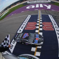 BROOKLYN, MICHIGAN - AUGUST 11: Kevin Harvick, driver of the #4 Mobil 1 Ford, takes the checkered flag to win the Monster Energy NASCAR Cup Series Consumers Energy 400 at Michigan International Speedway on August 11, 2019 in Brooklyn, Michigan. (Photo by Matt Sullivan/Getty Images)
