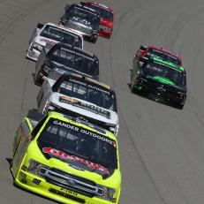 BROOKLYN, MICHIGAN - AUGUST 10: Matt Crafton, driver of the #88 Chi Chis/Menards Ford, leads a pack of trucks during the NASCAR Gander Outdoor Truck Series Corrigan Oil 200 at Michigan International Speedway on August 10, 2019 in Brooklyn, Michigan. (Photo by Matt Sullivan/Getty Images)