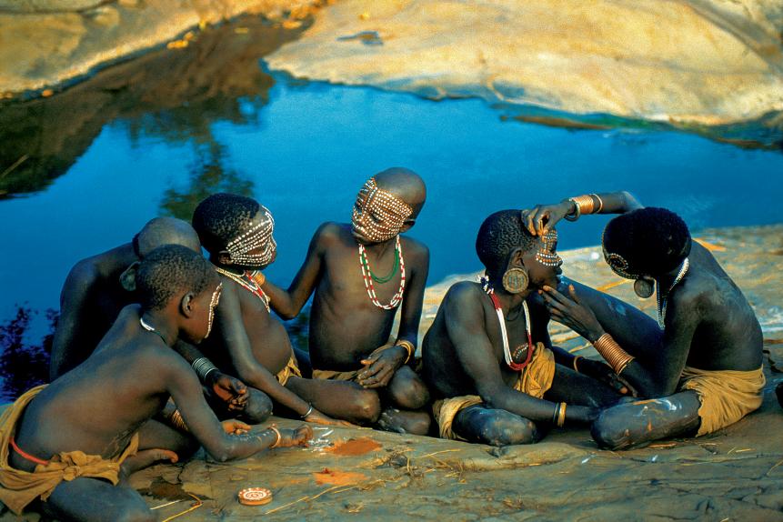 Surma Children Painting on the River Bank, Ethiopia