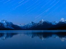 Star trails over Lake McDonald in mid winter in Glacier National Park, Montana.