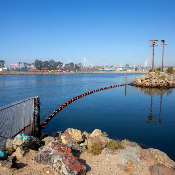 The LA River where it meets the Pacific Ocean in Long Beach, California. This is the entry point for migrating steelhead salmon that would hope to return to their spawning grounds in the mountains above Los Angeles. This marks the start of a nearly 40 mile journey upstream, though barriers above prevent a successful migration.