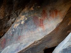 Pictographs are painted on using pigment, such as those seen here protected inside a cave. The darker areas of the cave where there is more shade reveal darker and more well-protected artwork, while the lower paintings are more faded by the sun. These locations are extremely important to the history of the first people to inhabit this region, so please always respect a site if you visit it!