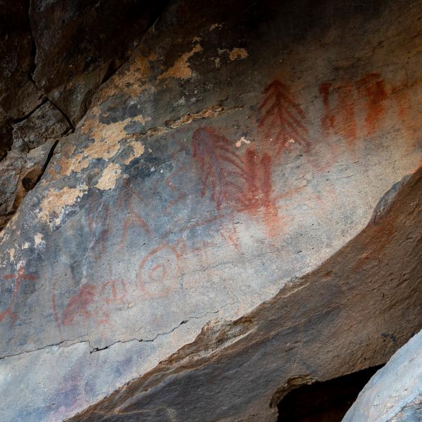 Pictographs are painted on using pigment, such as those seen here protected inside a cave. The darker areas of the cave where there is more shade reveal darker and more well-protected artwork, while the lower paintings are more faded by the sun. These locations are extremely important to the history of the first people to inhabit this region, so please always respect a site if you visit it!