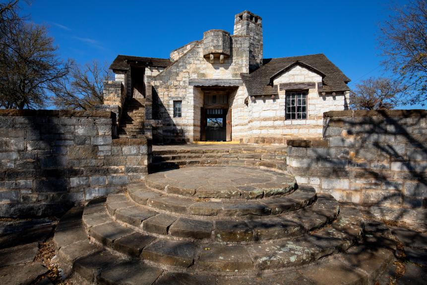 The Civilian Conservation Corps Conservation Tower that is located in Longhorn Cavern State Park in Burnet County, Texas. The structure is made of native stone quarried and cut from the excavated cavern below, local cedar, hand split shingles, and iron fixtures. It features a unique central circular lobby surrounded by quartz walls.