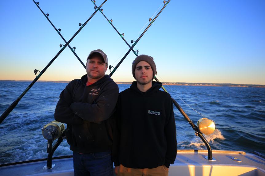 Julia Nicole Captain Dan Sr with son, Danny Jr on board the Julia Nicole with port of Gloucester in the background