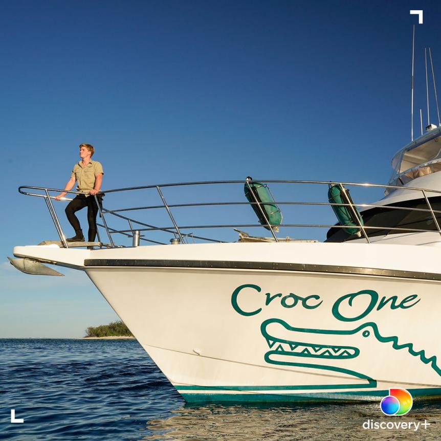 Robert Irwin gazes into the distance at the bow of the Croc One boat, near Lady Elliot Island, Australia