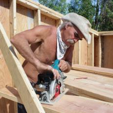 Marty Raney sanding wood beams