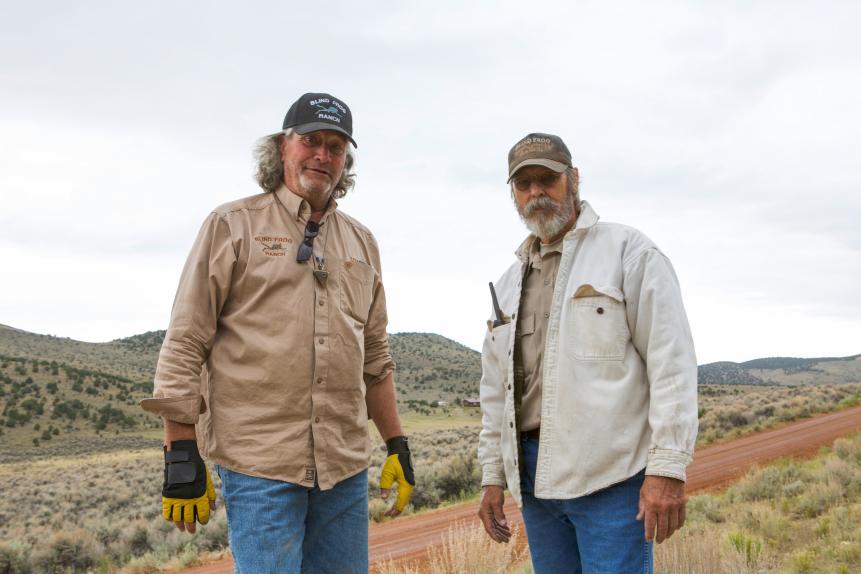 Duane Ollinger and Charlie Snider stand together on Blind Frog Ranch.