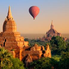 Hot air balloon tours are offered at sunrise to tour the temples of Bagan, Myanmar