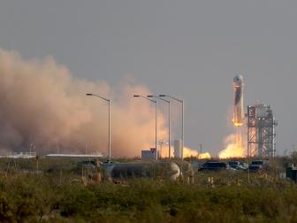 VAN HORN, TEXAS - JULY 20:  The New Shepard Blue Origin rocket lifts-off from the launch pad carrying Jeff Bezos along with his brother Mark Bezos, 18-year-old Oliver Daemen, and 82-year-old Wally Funk prepare to launch on July 20, 2021 in Van Horn, Texas. Mr. Bezos and the crew are riding in the first human spaceflight for the company.   (Photo by Joe Raedle/Getty Images)