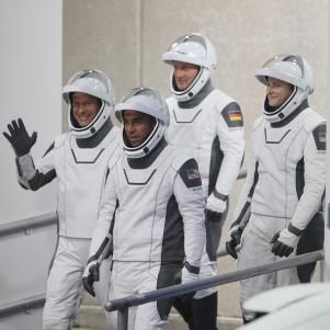 CAPE CANAVERAL, FLORIDA - NOVEMBER 10: (L-R front) NASA astronauts Tom Marshburn and Raja Chari and (L-R back) European Space Agency astronaut Matthias Maurer of Germany and NASA astronaut Kayla Barron walk out of the Operations and Checkout Building on their way to the SpaceX Falcon 9 rocket with the Crew Dragon spacecraft on launch pad 39A at the Kennedy Space Center on November 10, 2021 in Cape Canaveral, Florida. The astronauts are scheduled to lift off at 9:03pm to the International Space Station. (Photo by Joe Raedle/Getty Images)