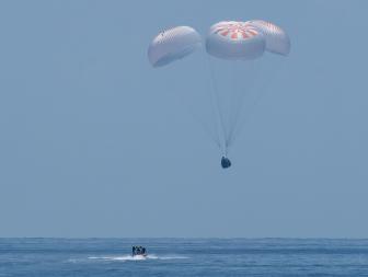 The SpaceX Crew Dragon Endeavour spacecraft is seen as it lands with NASA astronauts Robert Behnken and Douglas Hurley onboard in the Gulf of Mexico off the coast of Pensacola, Florida, Sunday, Aug. 2, 2020. The Demo-2 test flight for NASA's Commercial Crew Program was the first to deliver astronauts to the International Space Station and return them safely to Earth onboard a commercially built and operated spacecraft. Behnken and Hurley returned after spending 64 days in space. Photo Credit: (NASA/Bill Ingalls)