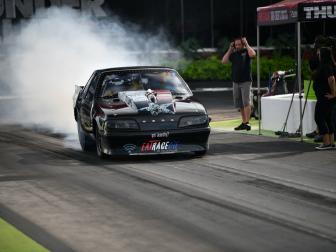 Mike Murillo and his precision Turbo Mustang perform a burnout.
