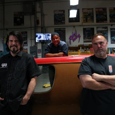 A close-up hero shot of (L to R) Beau Boeckmann, Mike Martin, and Dave Shuten posing with a diagonal Redd Wrecker.