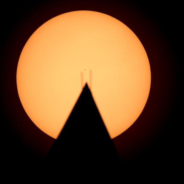 WASHINGTON, DC - NOVEMBER 11: In this handout provided by NASA, the planet Mercury is seen in silhouette, center, as it transits across the face of the Sun, behind the Washington Monument, November 11, 2019 in Washington, DC.  Mercurys last transit was in 2016 and the next wont happen again until 2032.  (Photo by Bill Ingalls/NASA via Getty Images)