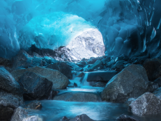In Juneau, Alaska, you can take a walk not just on, but in a glacier. That's right — inside the partially hollow Mendenhall Glacier is a surreal landscape of breathtakingly bright blue ice caves, accessible via hike, kayak, and a climb over the ice. You better get there soon, though, because this natural marvel is melting ... fast.