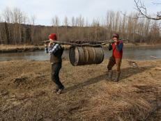 Eivin and August hauling barrel of supplies