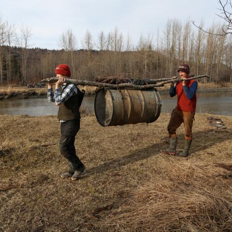 Eivin and August hauling barrel of supplies