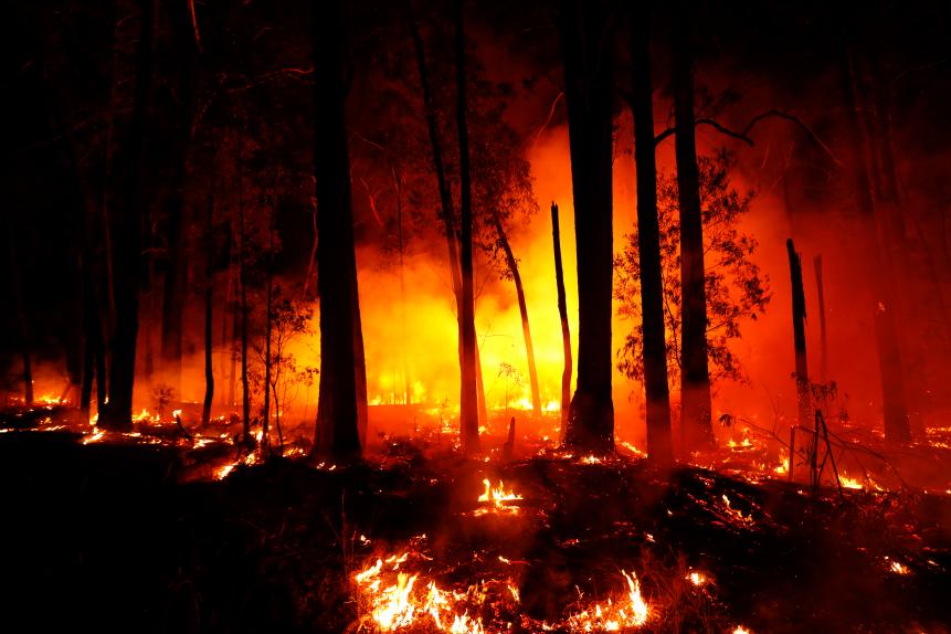 MALLACOOTA, AUSTRALIA - JANUARY 02: Bushfires are seen between the towns of Orbost and Lakes Entrance in east Gippsland on January 02, 2020 in Australia. The HMAS Choules docked outside of Mallacoota this morning to evacuate thousands of people stranded in the remote coastal town following fires across East Gippsland which have killed one person and destroyed dozens of properties. (Photo by Darrian Traynor/Getty Images)