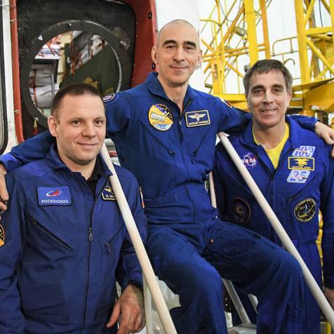 At the Baikonur Cosmodrome in Kazakhstan, Expedition 63 crewmembers Ivan Vagner (left) and Anatoly Ivanishin (center) of Roscosmos and Chris Cassidy (right) of NASA pose for pictures April 3 in front of their Soyuz spacecraft as part of their pre-launch activities. They will launch April 9 on the Soyuz MS-16 spacecraft from Baikonur on April 9 for a six-and-a-half month mission on the International Space Station.Courtesy/Roscosmos