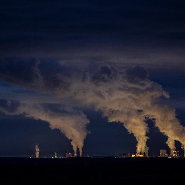 TORGA, GERMANY - OCTOBER 17: The coal-fired power stations of Boxberg (R) and Schwarze Pumpe (L) are pictured on October 17, 2020 in Torga, Germany. The Boxberg and Schwarze Pumpe power plants are going to be powered off in 2038 as part of the german coal phase-out. The region Lusatia in the east of Germany and its economic infrastructure is heavily dependent on the coal-fired power plants in Jaenschwalde, Schwarze Pumpe and Boxberg. (Photo by Florian Gaertner/Photothek via Getty Images)