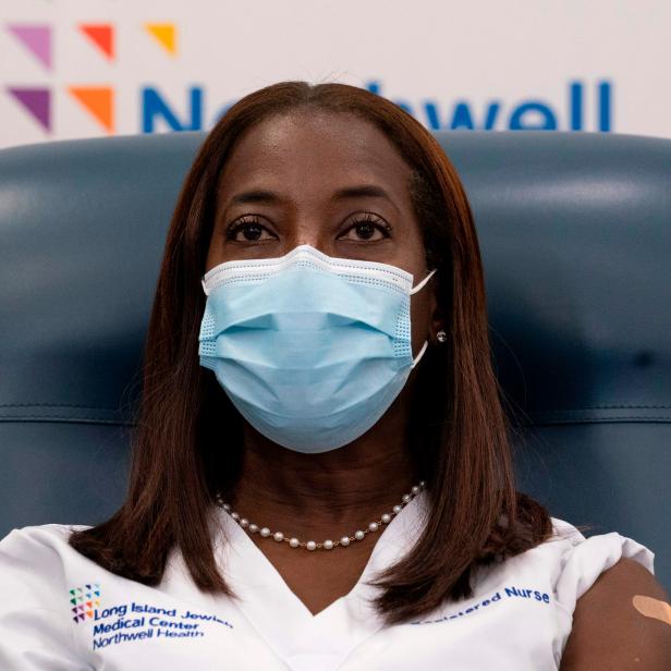 Nurse Sandra Lindsay participates in a conference call with Gov. Andrew Cuomo after she is inoculated with the Covid-19 vaccine at Long Island Jewish Medical Center, on December 14, 2020 in the Queens borough of New York. - The rollout of the Pfizer and BioNTech vaccine, the first to be approved by the Food and Drug Administration, ushers in the biggest vaccination effort in US history. More than 299,000 Americans have been killed by the virus, including over 35,000 residents of New York state. (Photo by Mark Lennihan / POOL / AFP) (Photo by MARK LENNIHAN/POOL/AFP via Getty Images)