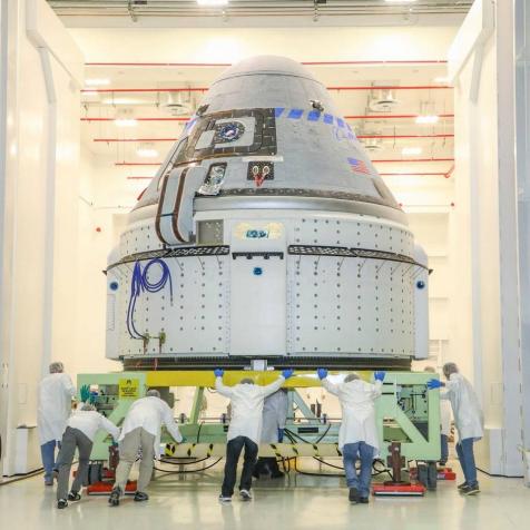 The CST-100 Starliner spacecraft to be flown on Boeing’s Orbital Flight Test (OFT) is viewed Nov. 2, 2019, while undergoing launch preparations inside the Commercial Crew and Cargo Processing Facility at Kennedy Space Center in Florida. During the OFT mission, the uncrewed Starliner spacecraft will fly to the International Space Station for NASA’s Commercial Crew Program.