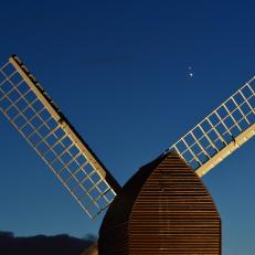 BRILL, ENGLAND - DECEMBER 20:  Jupiter and Saturn are seen coming together in the night sky, over the sails of Brill windmill, for what is known as the Great Conjunction, on December 20, 2020 in Brill, England. The planetary conjunction is easily visible in the evening sky and will culminate on the night of December 21. This is the closest the planets have appeared for nearly 800 years. (Photo by Jim Dyson/Getty Images)