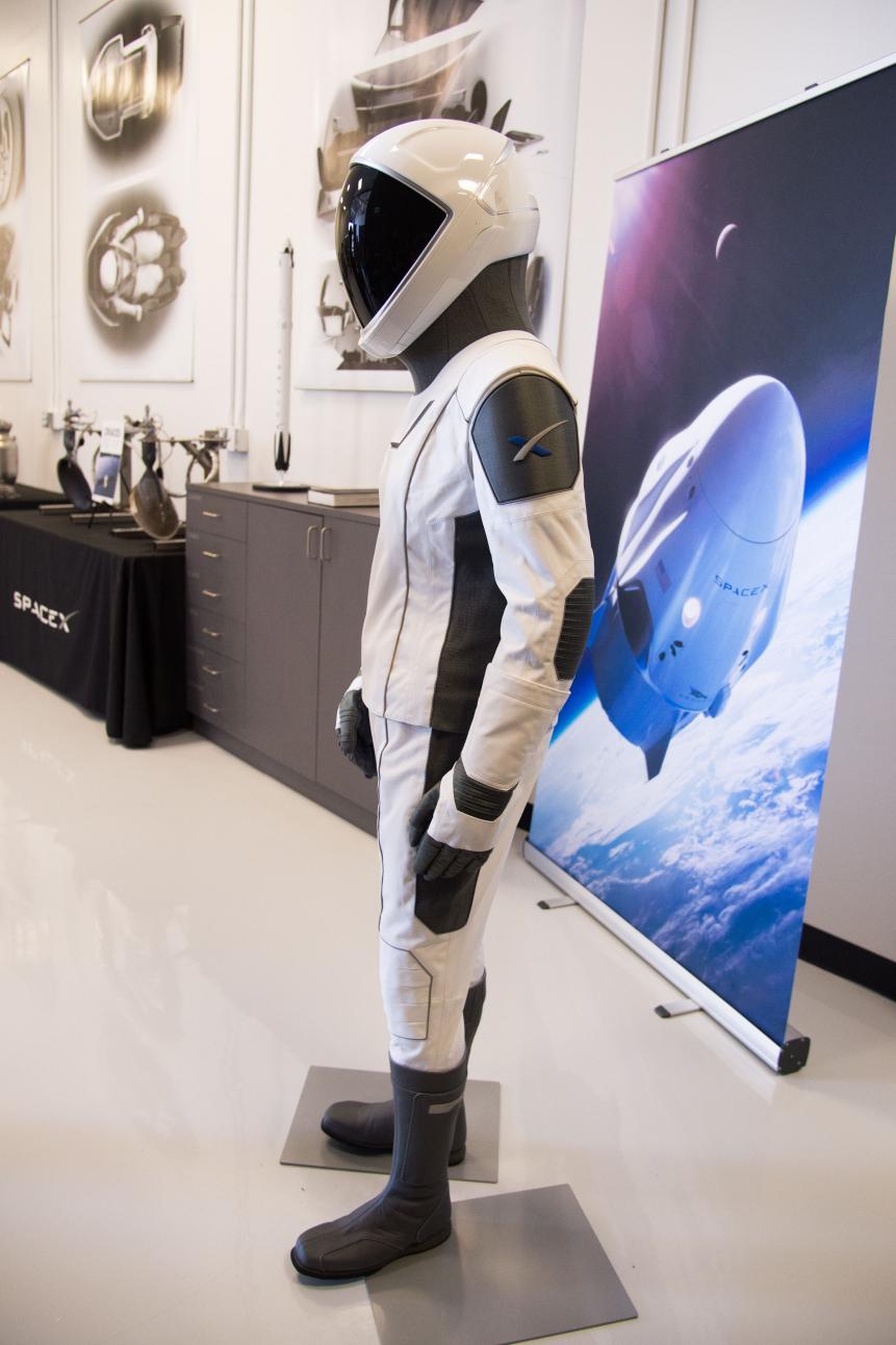 The SpaceX spacesuit to be wore by NASA astronauts that will travel to the International Space Station aboard the SpaceX Crew Dragon capsule is displayed during a media tour at SpaceX headquarters in Hawthorne, California, on August 13, 2018. - According to the Teslarati website the majority of the helmet is 3D printed and SpaceX has used that capability to directly integrate valves, a number of complex mechanisms for visor retraction and locking, microphones, and even air cooling channels into the helmets structure. The suit itself is designed so that necessary external connections (power, water, air, etc) all pass through one single umbilical panel located in the middle of the suitÃ s right thigh.  The suit is designed to allow astronauts to work in extreme conditions including hard vacuum but not space walks. (Photo by Robyn Beck / AFP)        (Photo credit should read ROBYN BECK/AFP via Getty Images)