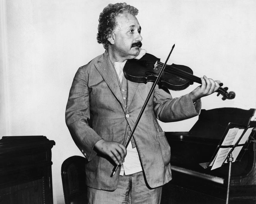 This heavily retouched photograph shows German-Swiss-American mathematical physicist Albert Einstein (1879 - 1955) as he plays a violin in the music room of the S.S. Belgenland en route to California, 1931. (Photo by Keystone/Getty Images)