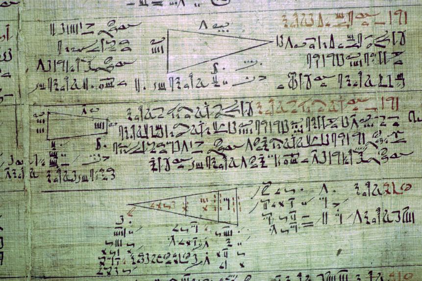 Detail of the Rhind mathematical papyrus, showing mathematical problems, from Thebes, Egypt, End of the Second Intermediate Period, c1550 BC. The text contains eighty-four problems concerned with numerical operations, practical problem-solving, and geometrical shapes. From the British Museum Collection. (Photo by CM Dixon/Print Collector/Getty Images)