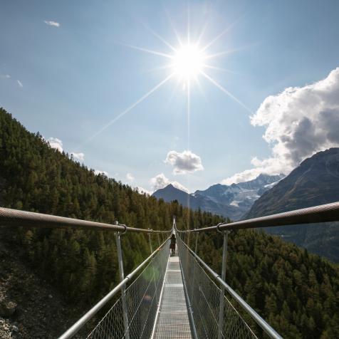 The Charles Kuonen Suspension Bridge, in the Swiss Alps, near the village of Randa, is a record-breaking 494 metres long and connects GrÃ¤chen and Zermatt on the Europaweg foot trail. It is the worldâ  s longest pedestrian suspension bridge in Switzerland.