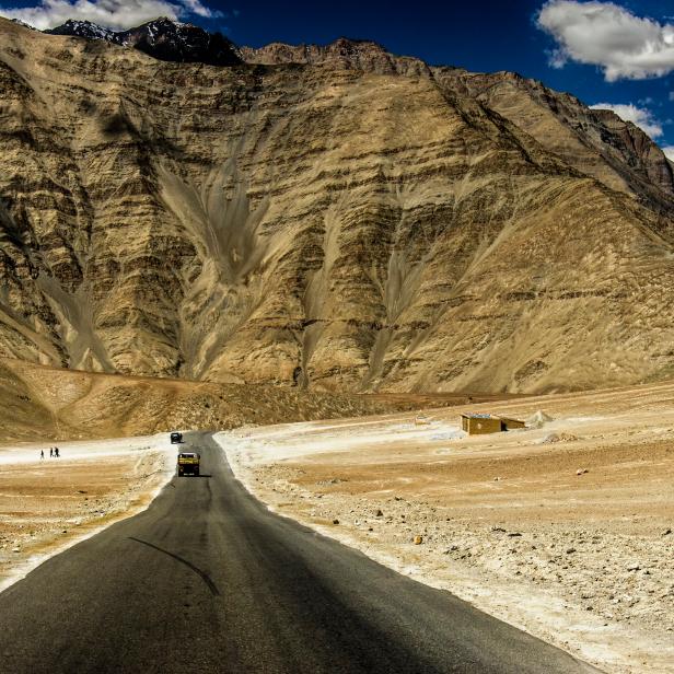 Magnet Hill is a so-called "gravity hill" located near Leh in Ladakh, India.The magnet Hill is located on the Leh-Kargil-Srinagar national highway, about 30 km from Leh, at a height of 11,000 feet above sea level. On its south side flows the Indus, which originates in Tibet and goes to Pakistan. The magnetic hill has become a popular stop for domestic tourists on car journeys. The alignment of the road with the slope of the background can give the illusion that cars are able to drift upwards.