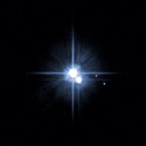 A pair of small moons orbiting pluto discovered by NASA's Hubble Space Telescope: Nix and Hydra are roughly 5,000 times fainter than Pluto and are about two to three times farther from Pluto than its large moon, Charon. (Photo by: Universal History Archive/Universal Images Group via Getty Images)
