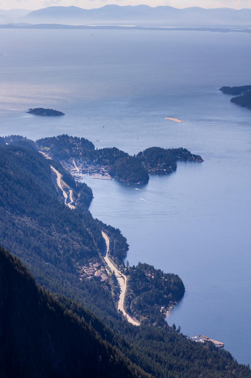 From a hiking trail in West Vancouver, hikers get a glimpse of the Sea-to-Sky highway leading to Whistler, the small village of Horseshoe Bay and across the Georgia Strait to the Gulf Islands and the mountains of Vancouver Island.