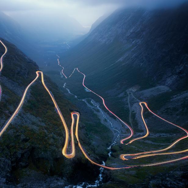 Light trails on the Trollstigen road in Norway at night . .