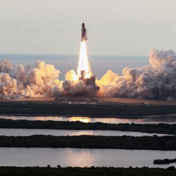 CAPE CANAVERAL, FL - MAY 16:  NASA space shuttle Endeavour lifts off from Launch Pad 39A at the Kennedy Space Center on May 16, 2011 in Cape Canaveral, Florida. After 20 years, 25 missions and more than 115 million miles in space, Endeavour is on its final flight to the International Space Station before being retired and donated to the California Science Center in Los Angeles. Capt. Mark E. Kelly, Gabrielle Giffords's husband, will lead mission STS-134 as it delivers the Express Logistics Carrier-3 (ELC-3) and the Alpha Magnetic Spectrometer (AMS-2) to the International Space Station.  (Photo by Joe Raedle/Getty Images)