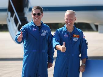 CAPE CANAVERAL, FLORIDA - MAY 20: NASA astronauts Bob Behnken (left) and Doug Hurley (right) pose for the media after arriving at the Kennedy Space Center on May 20, 2020 in Cape Canaveral, Florida.  The astronauts arrived for the May 27th scheduled inaugural flight of SpaceXâ  s Crew Dragon spacecraft. They will be the first people since the end of the Space Shuttle program in 2011 to be launched into space from the United States. (Photo by Joe Raedle/Getty Images)
