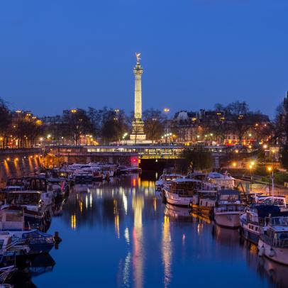 France, Ã®le-de-France, Paris (75), Banks of the Seine, a UNESCO World Heritage Site, Bastille district, the Arsenal Harbor and the July Column in the distance.