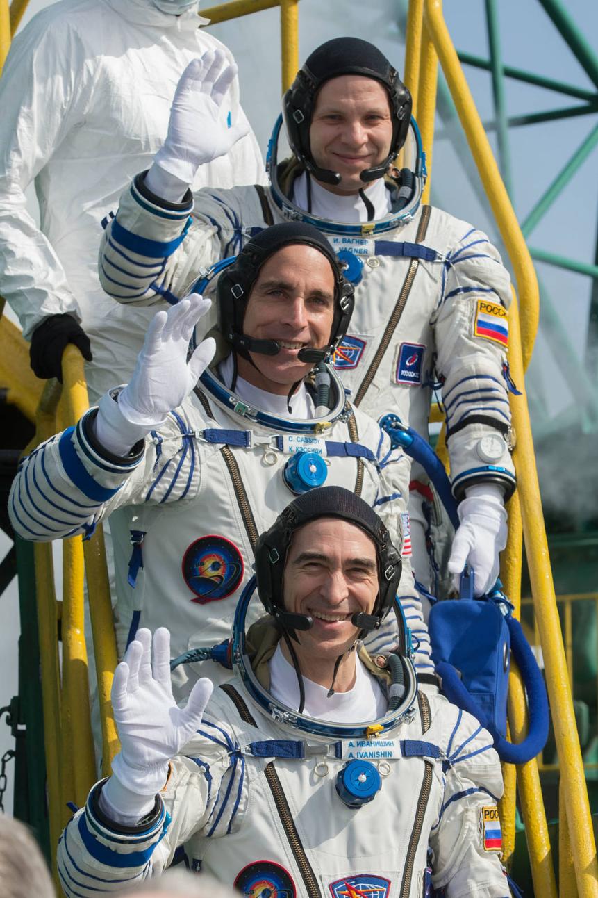 Expedition 63 crewmembers Ivan Vagner of Roscosmos, top, Chris Cassidy of NASA, center, and Anatoly Ivanishin wave goodbye as they prepare to climb aboard the Soyuz MS-16 rocket at Site 31 at the Baikonur Cosmodrome in Kazakhstan, Thursday, April 9, 2020. They launched a short time later to the International Space Station for the start of a six-and-a-half month mission. Photo Credit: (NASA/GCTC/Andrey Shelepin)