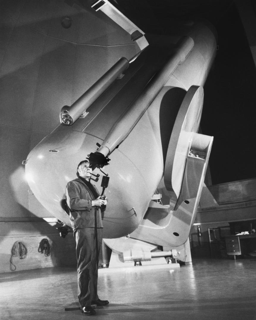 Dr. Edwin P. Hubble, one of America's foremost astronomers, runs the 48-inch Schmidt Photographic Telescope through its final series of rehearsals for the National Geographic Society-Palomar Observatory sky survey. The project will prove the first ever definitive photo atlas of the heavens.