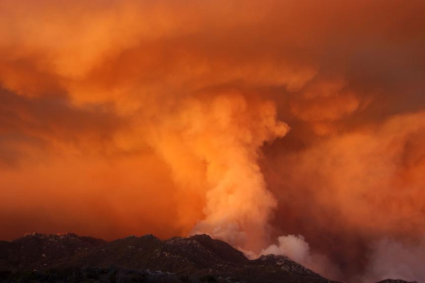 BORREGO SPRINGS, CA - AUGUST 7:  Smoke takes on the appearance of a colossal tornado as it rises from upper Borrego Palm Canyon in the Anza-Borrego Desert State Park near the boundary of the Los Coyotes Indian Reservation August 7, 2002 west of Borrego Springs, California. Borrego Palm Canyon is one of the park's primary attractions and is in the heart of rare and endangered peninsular desert bighorn sheep habitat. The 600,000-acre Anza-Borrego Desert State Park is the largest state park in the contiguous United States. The Pine Fire has burned more than 50,000 acres, destroyed at least 41 structures, and cost more than $12 million to fight so far.  (Photo by David McNew/Getty Images)