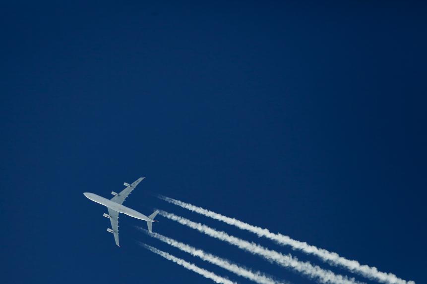 Swiss Airbus A340-313 from below against blue sky with plenty of copy space
