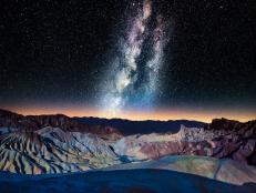 Please consider this image for Prestige Rights Managed. A VERY difficult shot to obtain.The Milky Way over Zabriskie Point with Panamint Range glowing in distance, Mojave Desert.