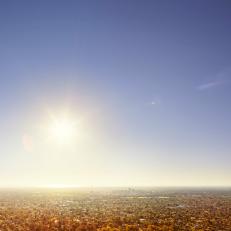 the sun shining above the city of Adelaide, Australia.
